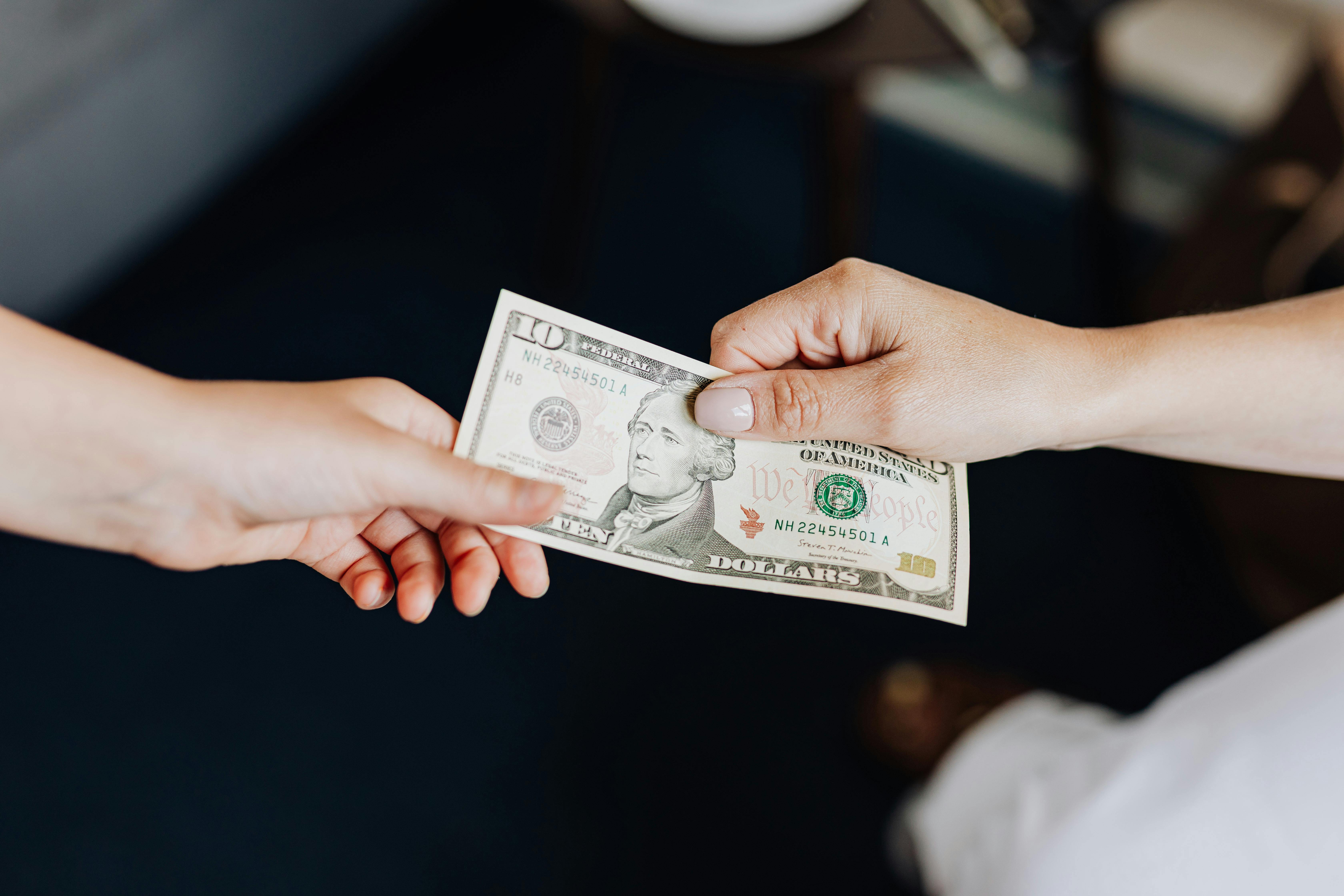 Money given from one hand to another