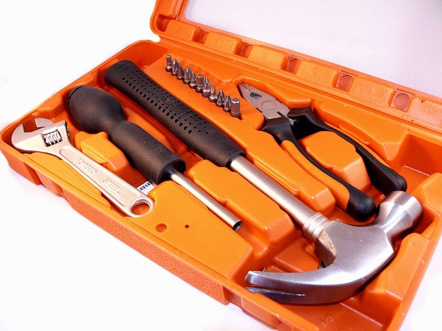 Open orange toolbox with assorted hand tools neatly arranged..jpg